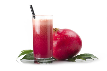 a glass of pomegranate juice on white backgroundの写真素材