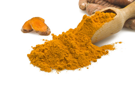 dust of ground turmeric on the spoon の写真素材