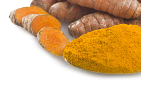 dust of ground turmeric on the spoon の写真素材