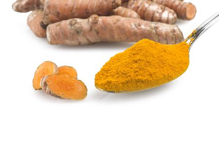 dust of ground turmeric on the spoon の写真素材