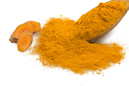dust of ground turmeric on the spoon の写真素材