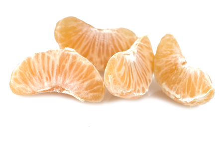 Mandarin or Tangerine fruit with leaves on a white backgroundの写真素材