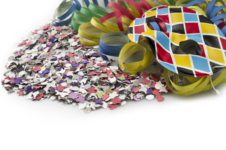 Carnival mask on colorful confetti and streamer backgroundの写真素材