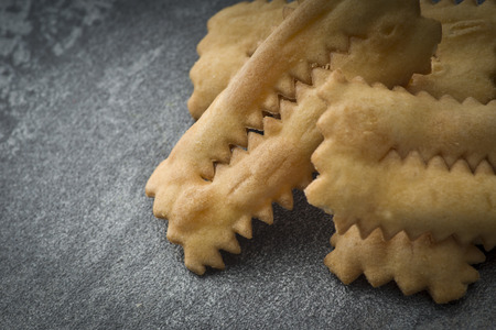 Tipical italian cake "Chiacchere" for carnival partyの写真素材