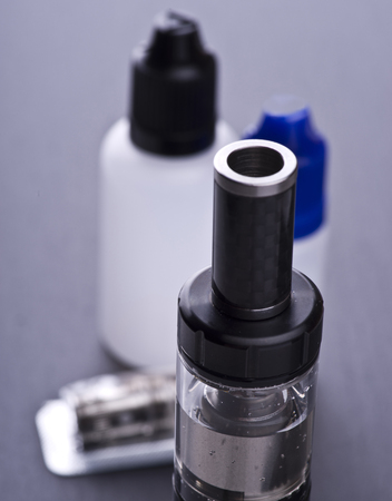modern vaporizer boxmod e-cig device on grey background