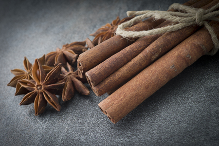 Star anise,cinnamon and licorice on grey backgroundの写真素材