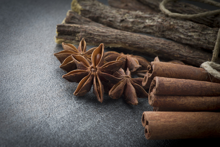 Star anise,cinnamon and licorice on grey backgroundの写真素材