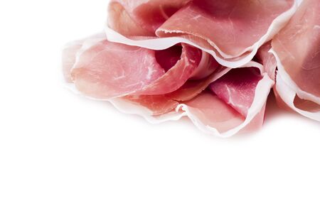 Raw ham leg sliced  on the whiteの写真素材