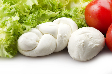 Mozzarella tomatoes and fresh salad on the whiteの写真素材