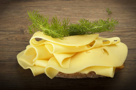 Swiss cheese slices close up on the wood
の写真素材