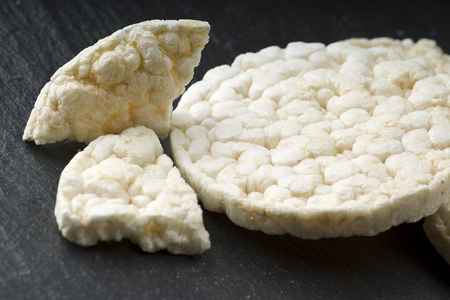Pile of rice crackers on the gray backgroundの写真素材