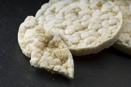 Pile of rice crackers on the gray backgroundの写真素材