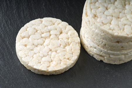 Pile of rice crackers on the gray backgroundの写真素材