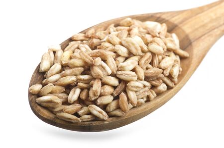 Spoon of Raw Organic Spelt Grain close up on the whiteの写真素材
