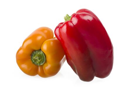 colored peppers close up over white backgroundの写真素材
