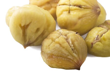 group of chestnuts on a wooden tableの写真素材