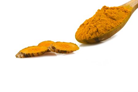 dust of ground turmeric on the spoonの写真素材