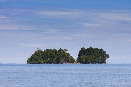 Tropical island with clear water and lush vegetation in Caribbean coast of Costa Rica