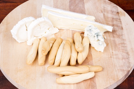 Cheese board and breadsticksの写真素材