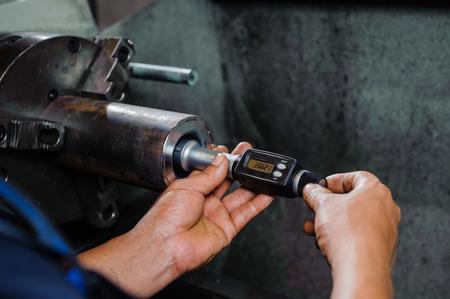 worker taking measurementの写真素材