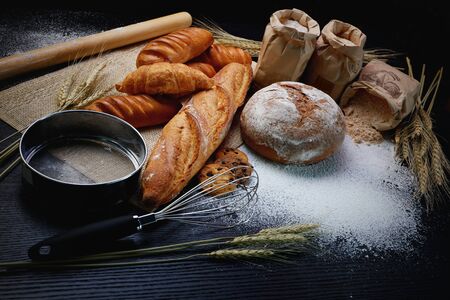 many type of bread studio shot with  ingredients flour seed  grain all aroundphoto take with high...