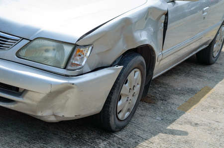 a scared marks on a front-left car body from accidentally hit by fast drive motorcycle, show broken...