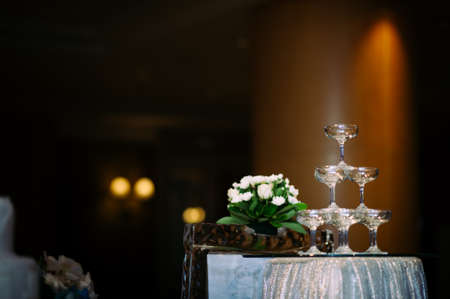 small tower of champagne's glass in wedding reception party