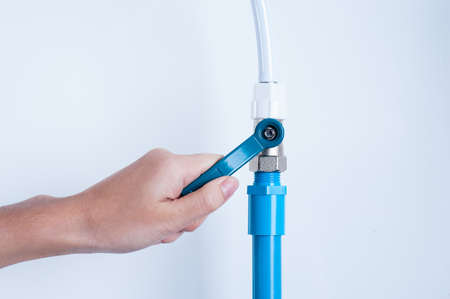 hand with pipe and valve