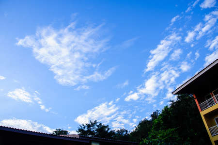 vivid blue sky with cloudsの写真素材