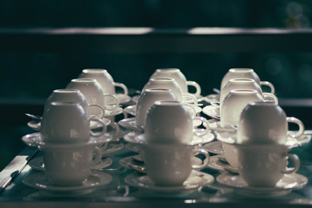 Coffee cup on table in coffee shop - vintage filter effectの写真素材