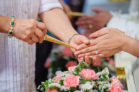 Wedding Ceremony. Hands of bride and groom with wedding ringsの写真素材