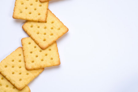line of crackers put on white table with empty spaceの写真素材
