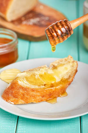 Sweet breakfast table with bread and honey
