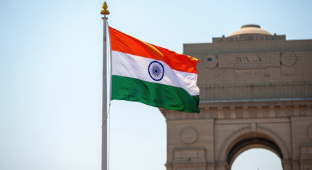 Indian national flag against india gate backdrop in new delhiの素材