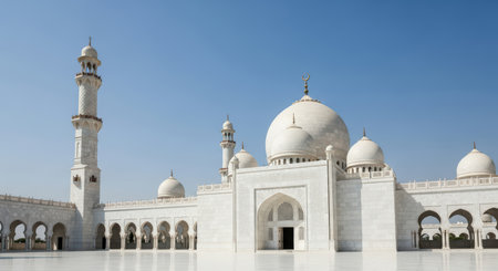 Majestic white domed mosque with ornate minarets and arched courtyardの素材