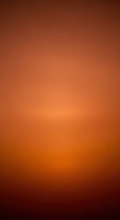 Warm gradients of orange and brown blurred abstract backgroundの素材