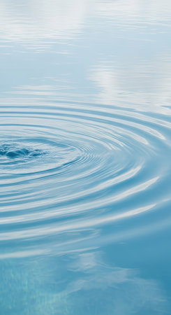 Tranquil water ripple patterns on serene blue surfaceの素材
