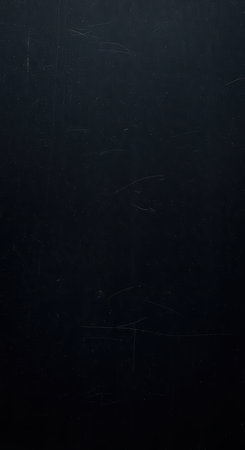 Dark textured surface with scratches and subtle patternsの素材