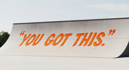Motivational message on skate ramp: "you got this" in bold orange textの素材