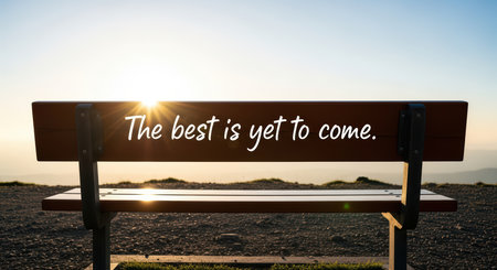 Inspirational quote on park bench at sunriseの素材