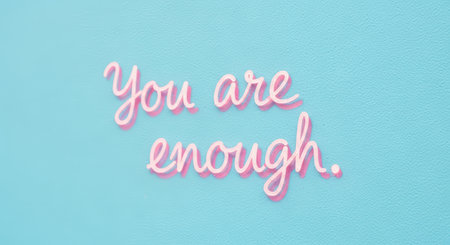 Inspirational quote against blue background: you are enough in pink scriptの素材