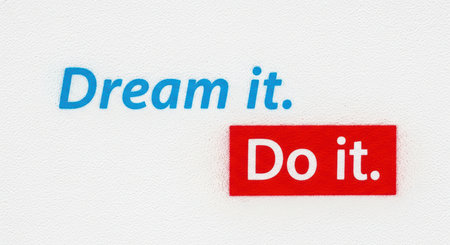 Inspirational quote art: dream it, do it in blue and red text on white backgroundの素材