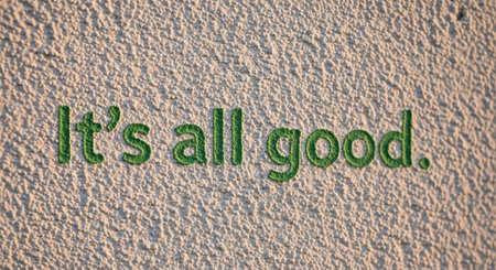 Positive encouragement message on textured wall surfaceの素材