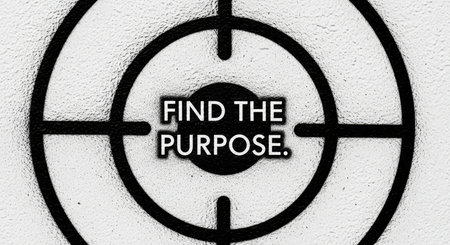 Black target with motivational text 'find the purpose' on textured white wallの素材