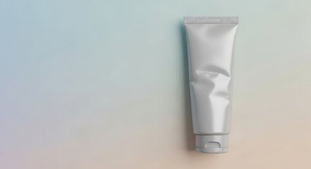 Metallic gray cosmetic tube on gradient backgroundの素材