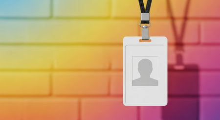 Blank id badge on colorful brick wall background with shadowの素材