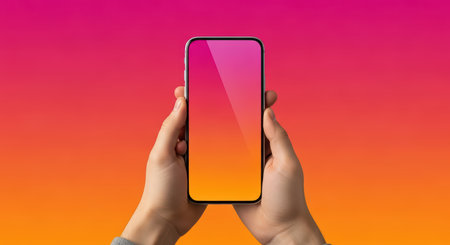 Close-up of person holding smartphone with gradient backgroundの素材