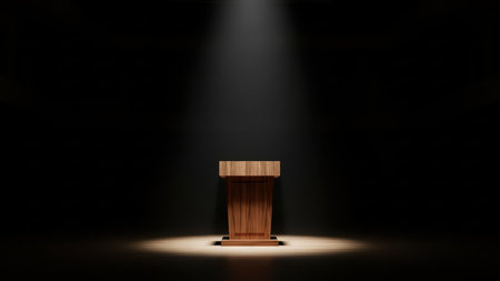 Spotlit wooden podium in dark empty auditorium scene.の素材