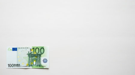 Single 100 euro banknote on white background.の素材