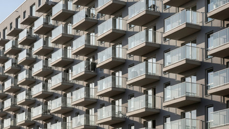Modern urban architecture: contemporary apartment building facade with glass balconies.の素材
